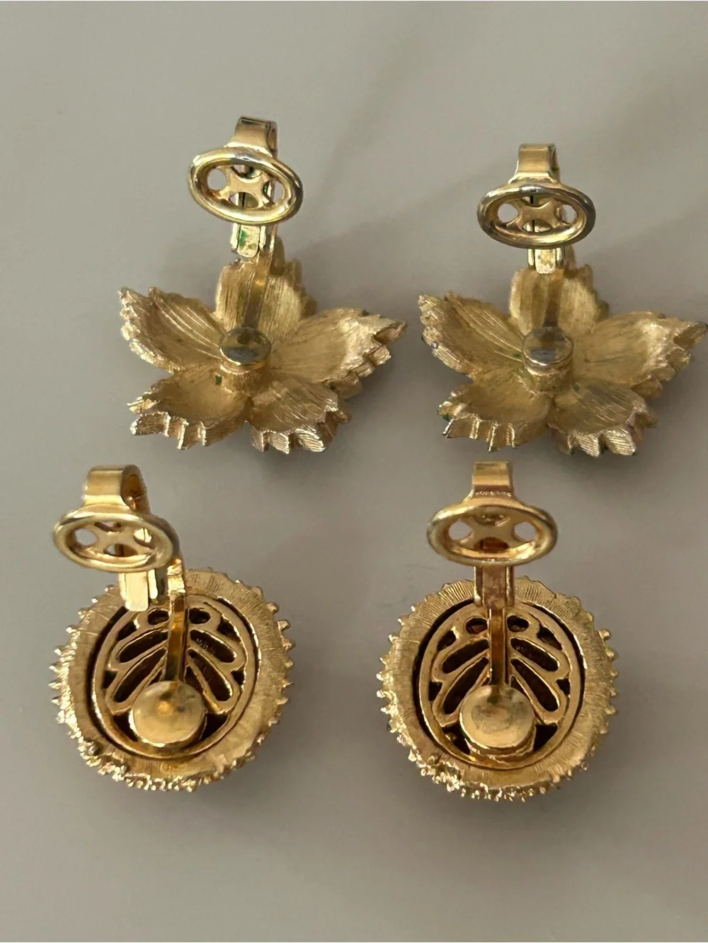 2 pairs of #CrownTrifari Clip-on Earrings. Gold-Tone Ribbed Domes and Florals.